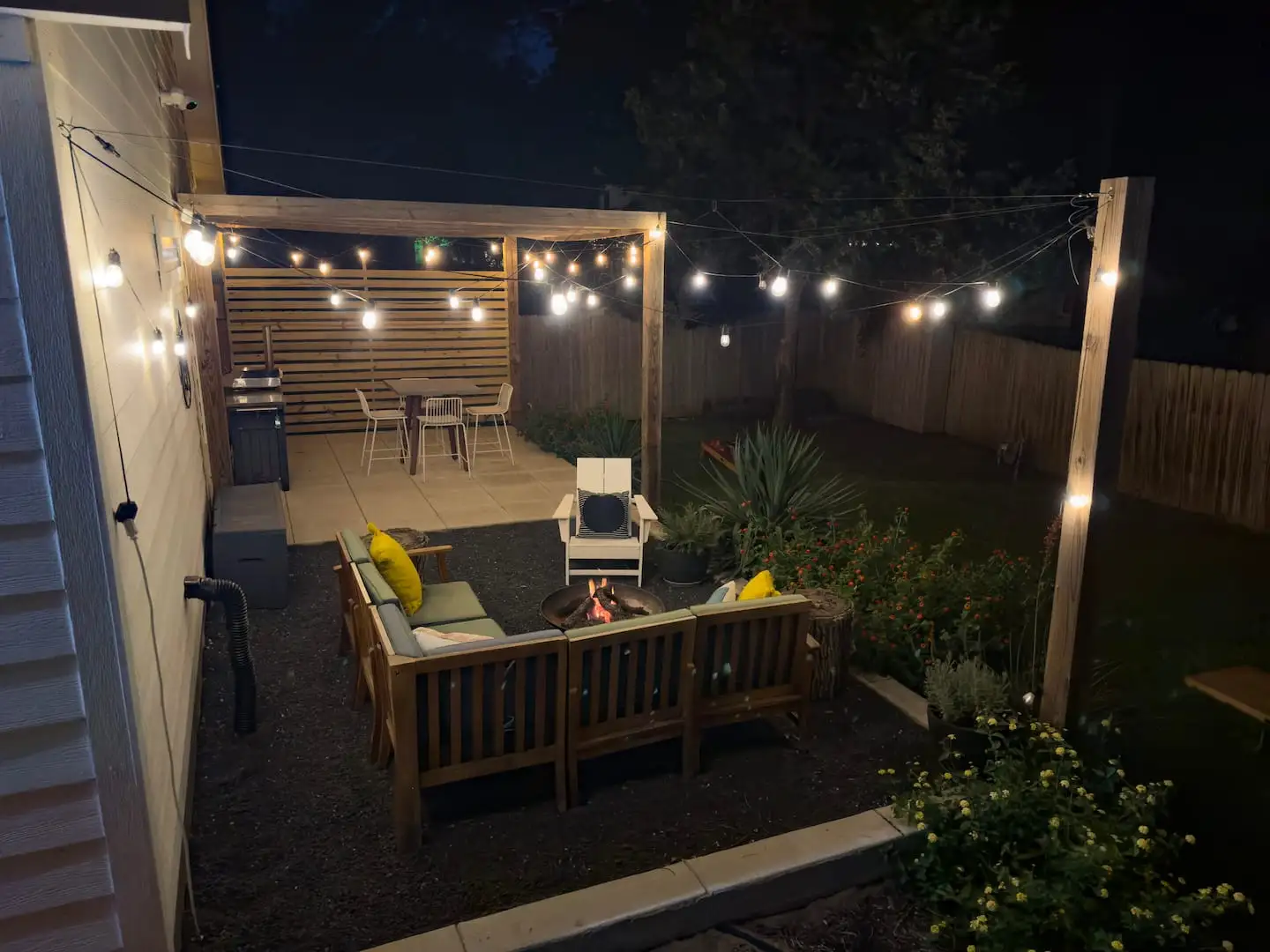 Backyard at night under string lights