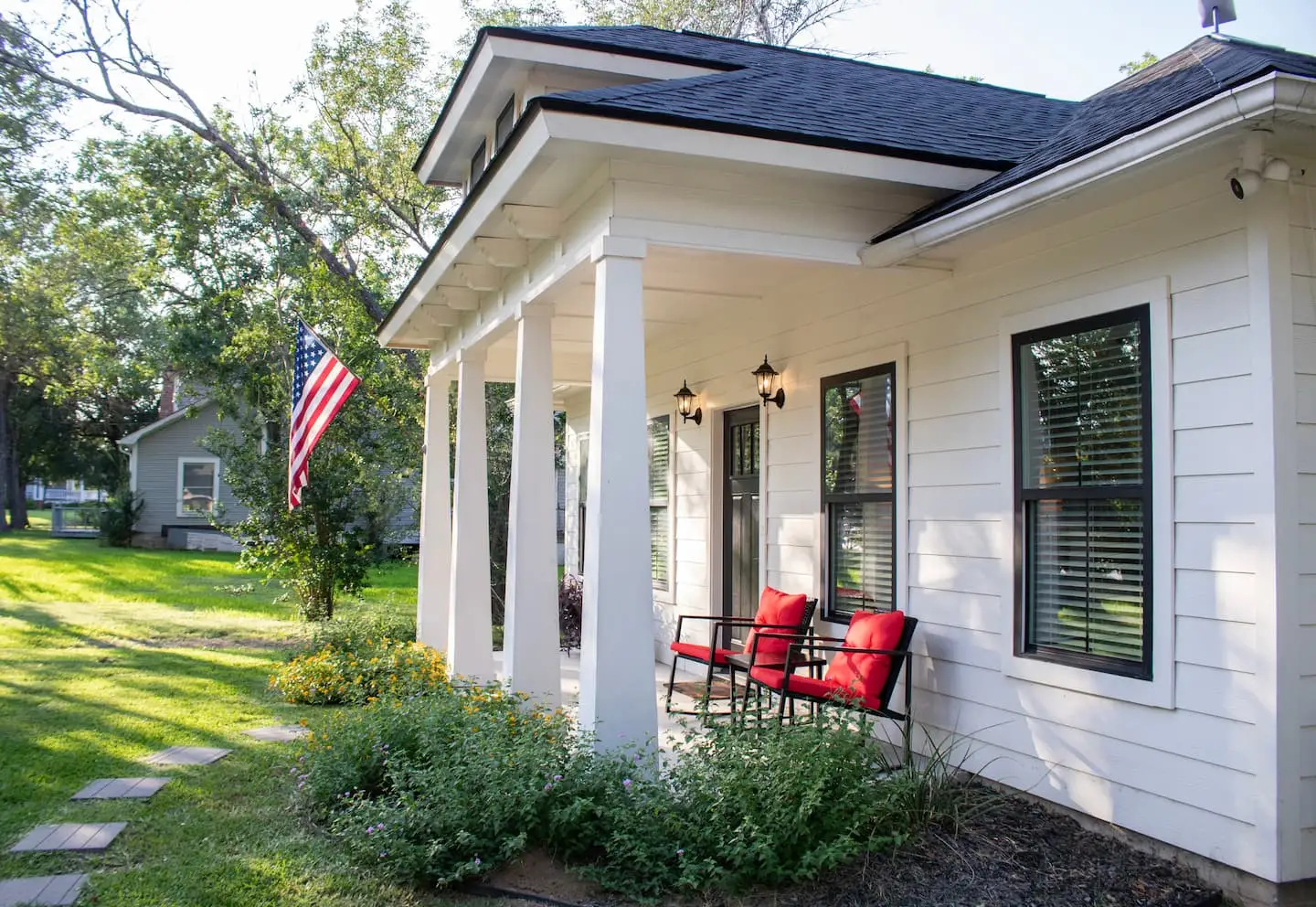 Front porch with red chairs