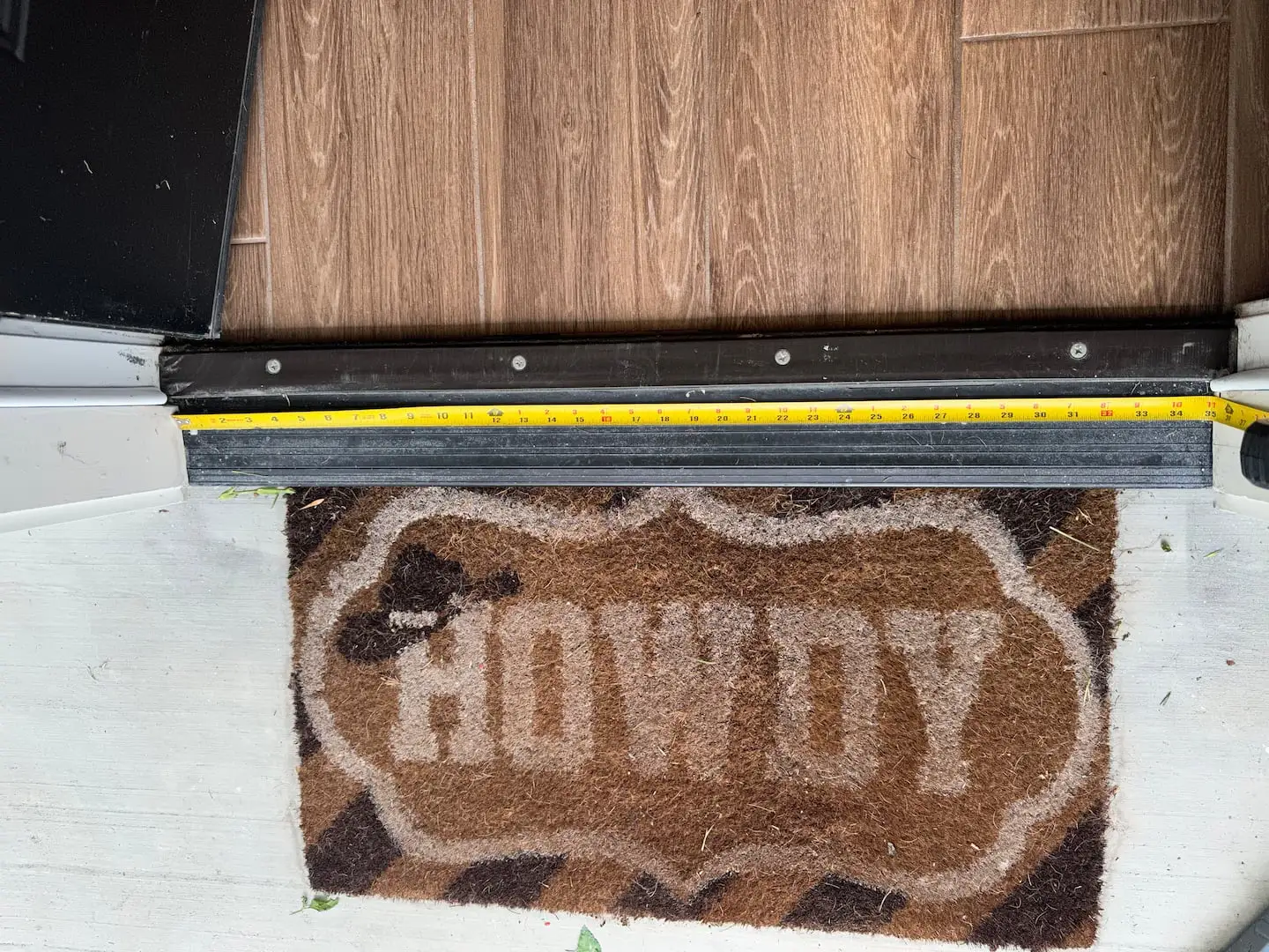 Howdy welcome mat at the front door