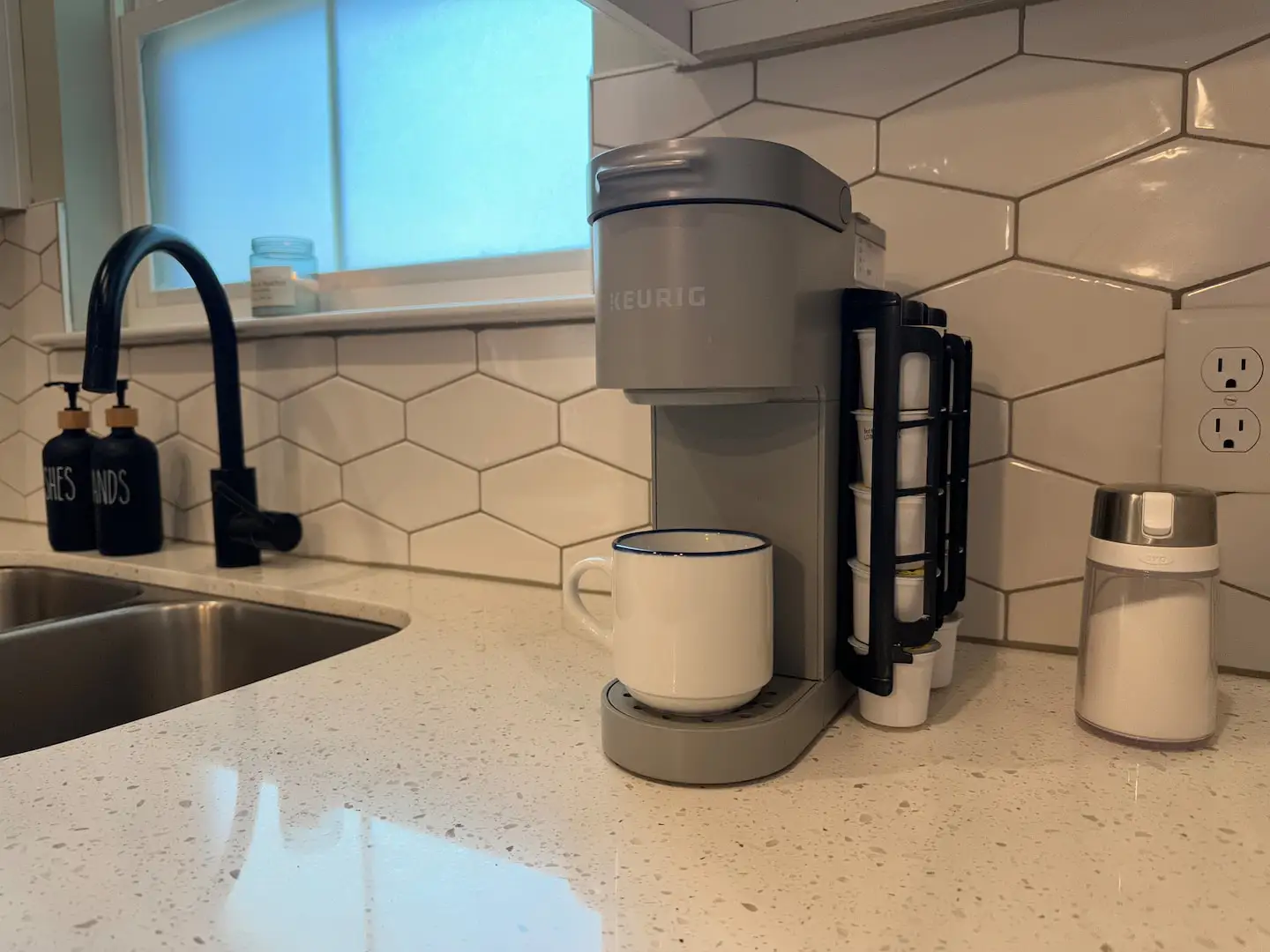 Keurig coffee maker by the kitchen sink
