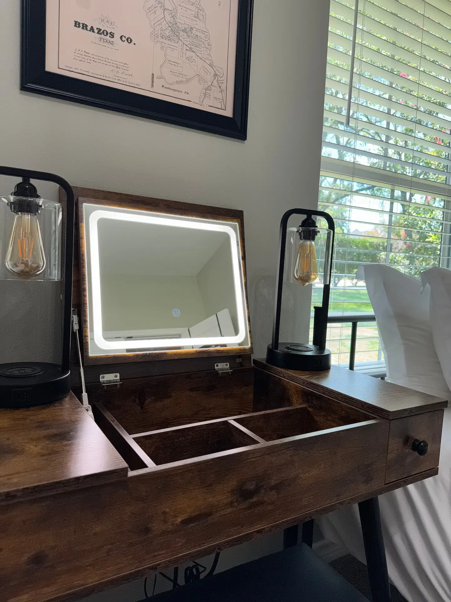 Vanity with lighted makeup mirror